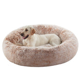 BedStill cama donut para perros talla XL, envolvente y cálida para tranquilidad nocturna.