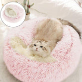 Cama-gato-redonda-capucha-rosa-grande ofrece refugio cálido para tu mascota.