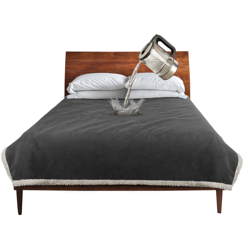 Manta impermeable Catalonia para cama, protege muebles y ropa de derrames.
