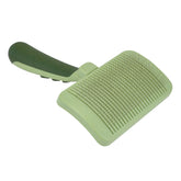 Cepillo Coastal Safari con auto-limpieza para perros y pelos sueltos.