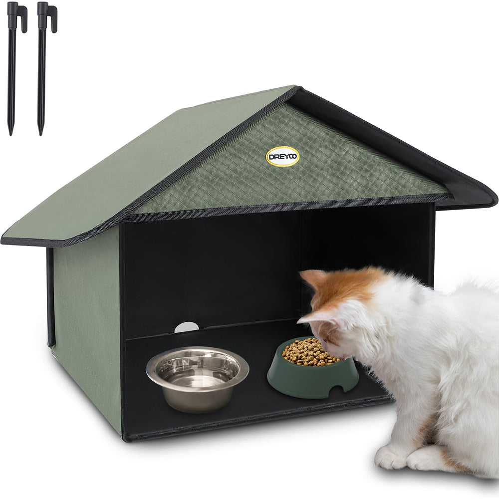 Estación de alimentación para gatos Dreyoo con techo inclinado mantiene la comida seca al aire libre.