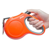 Correa retráctil Fida 16 ft en naranja, ideal para paseos de perros grandes.