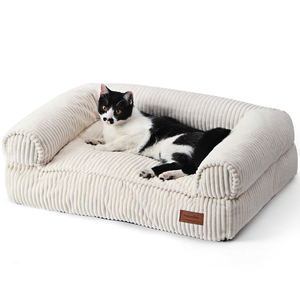 Cama sofá FUKUMARU de pana crema, lujo cálido para tu mascota.