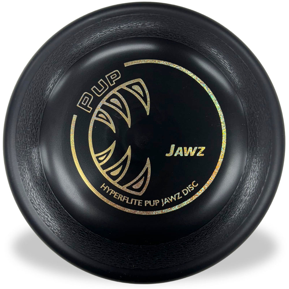 Hyperflite Pup Jawz disco negro en primer plano listo para juego activo.
