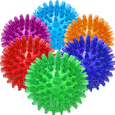 Jalousie: bola espinosa azul con chirrido para juego interactivo y limpieza dental.