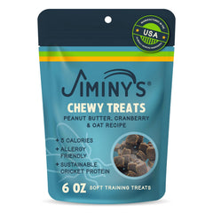Jiminy’s frente al empaque de premios masticables para perros, ideal para entrenamiento.