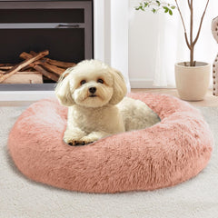Cama donut JOLLYVOGUE para mascotas de 20 pulgadas en rosa durazno ofrece calma y confort.