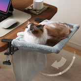 JUNSPOW cama para gato en escritorio doblado: apoyo estable para trabajo y descanso del gato.