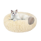 Cama Nisrada para gatos con diseño en dona y soporte para la cabeza.
