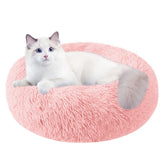 Cama Nisrada para gatos redonda con borde elevado y apoyo para cabeza.