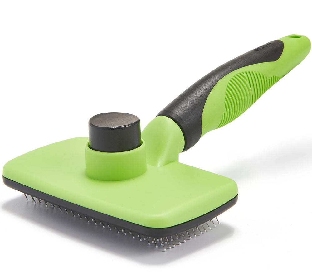 OEFEO cepillo autolimpieza verde para perros y gatos, elimina pelos sueltos con suavidad.