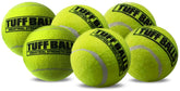 Pelota PetSport Tuff Ball amarilla en acción de lanzamiento para juego activo.