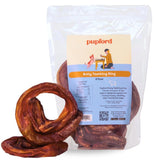 Pupford anillos de palitos de carne para cachorros masticando.