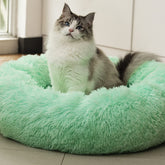 Cama Raimaiso donut peluche verde claro para descanso suave de mascotas