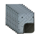 Almohadilla lavable RIOUSSI gris con estrellas para entrenamiento limpio.