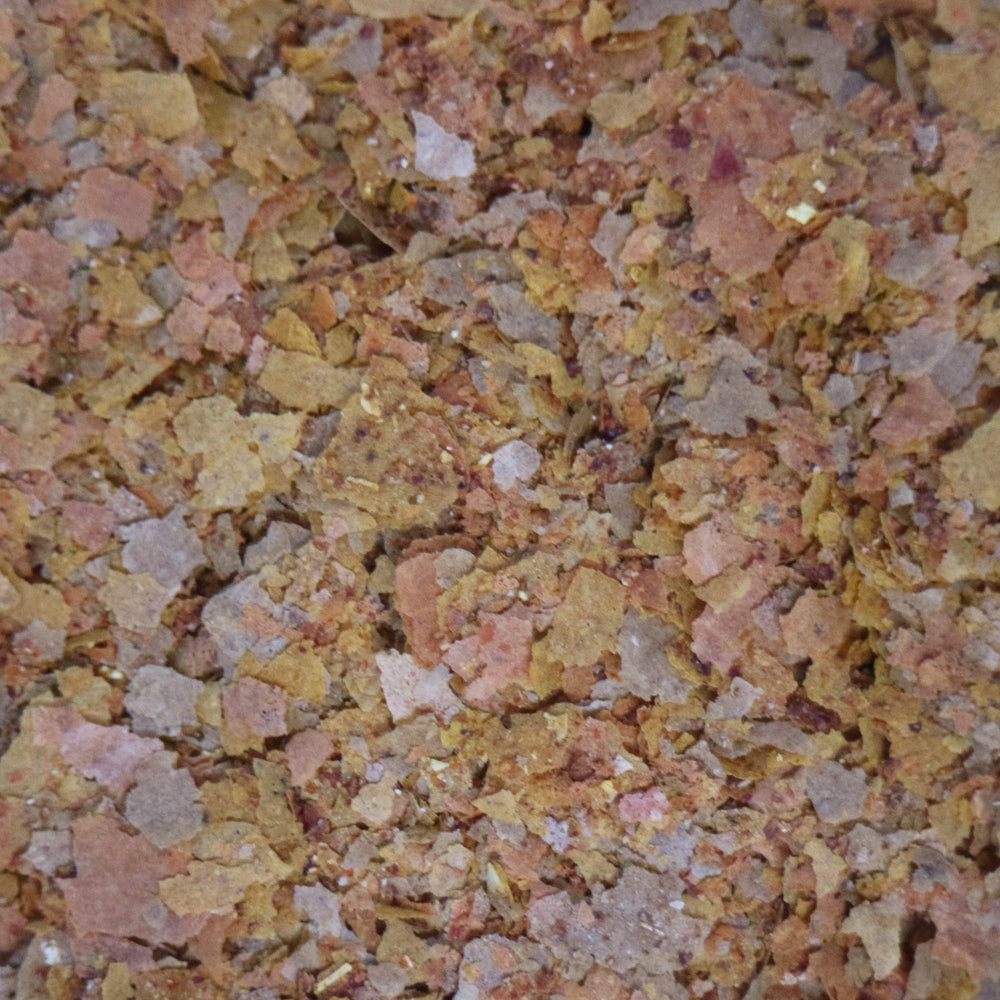 API Tropical Flakes: reduce residuos y mantiene el agua más clara.