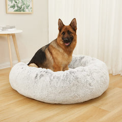 Bedfolks Cama antiansiedad gris en forma de rosquilla para relajación suave.