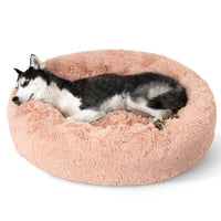 Bedsure cama para perro donut rosada, diseño suave que invita a dormir abrazado.