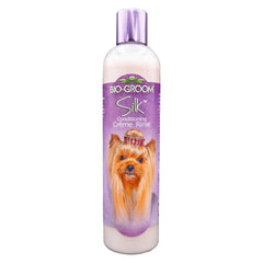 Bio-Groom acondicionador seda crema para perros, botella volcada para uso rápido.