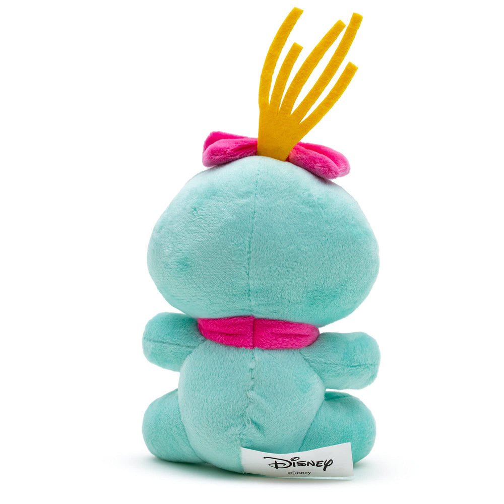 Scrump en pose sentada, juguete Buckle-Down Disney para abrazar y acompañar paseos.