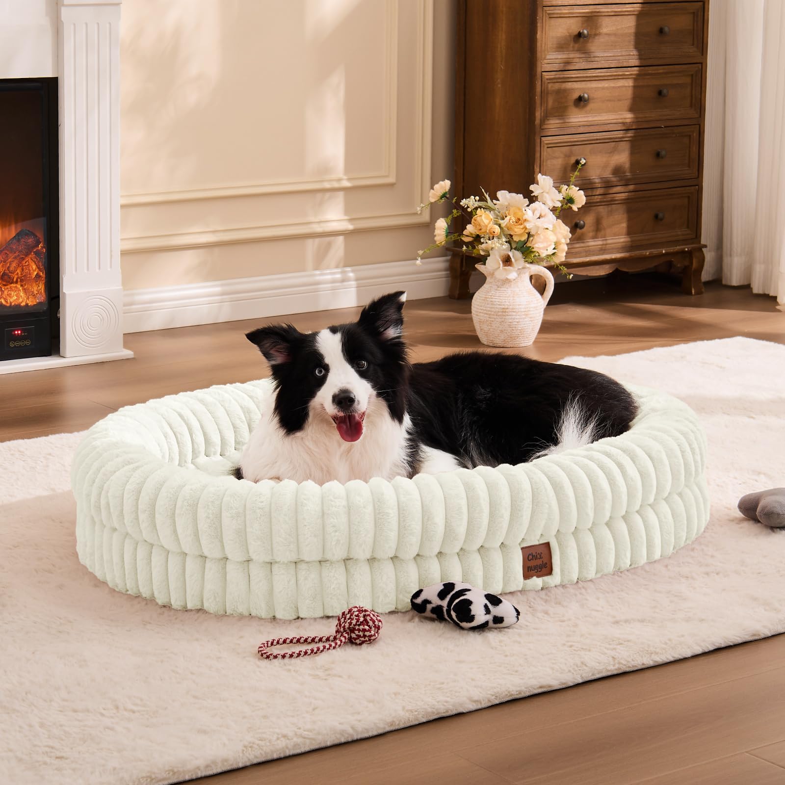ChiXnuggle XL cama perro con rayas crema, descanso cómodo y lujoso.