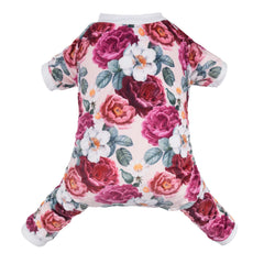 Pijama CuteBone para perro con flor rosa, ideal para fotos festivas.