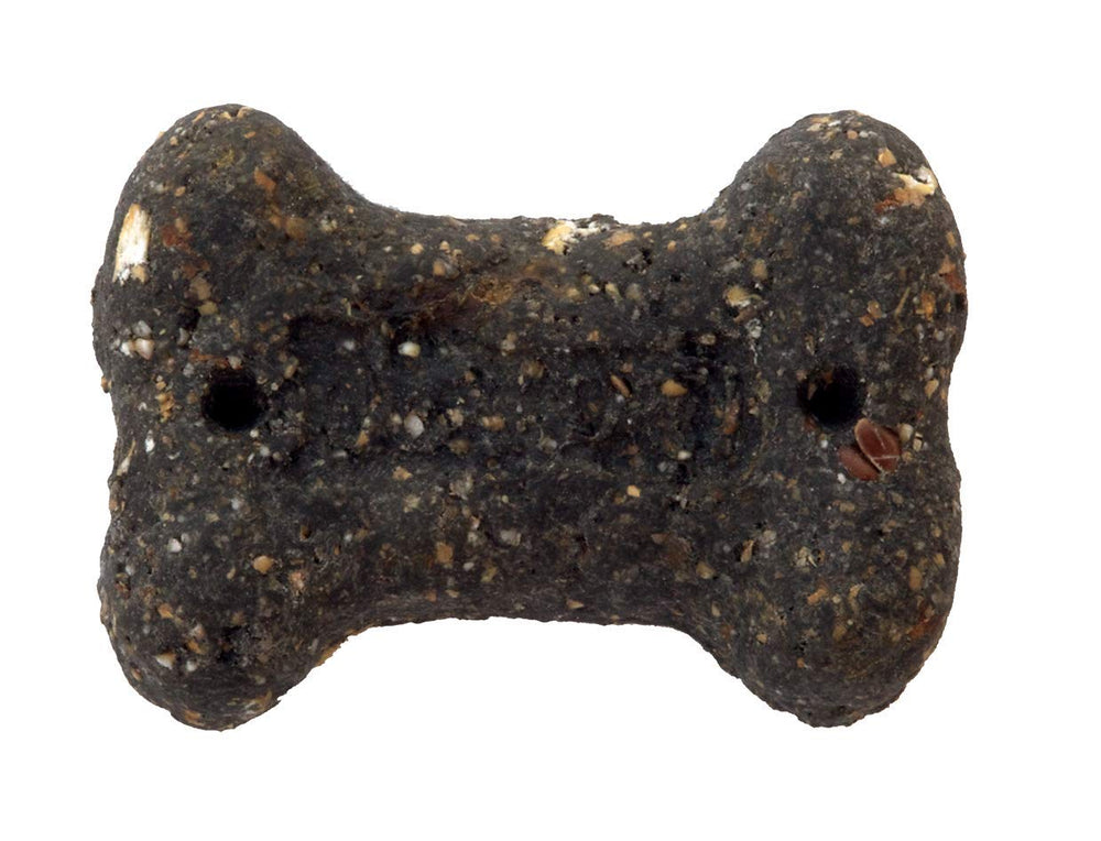 Perro masticando Charmint mini, recompensa sabrosa y fácil de dosificar.