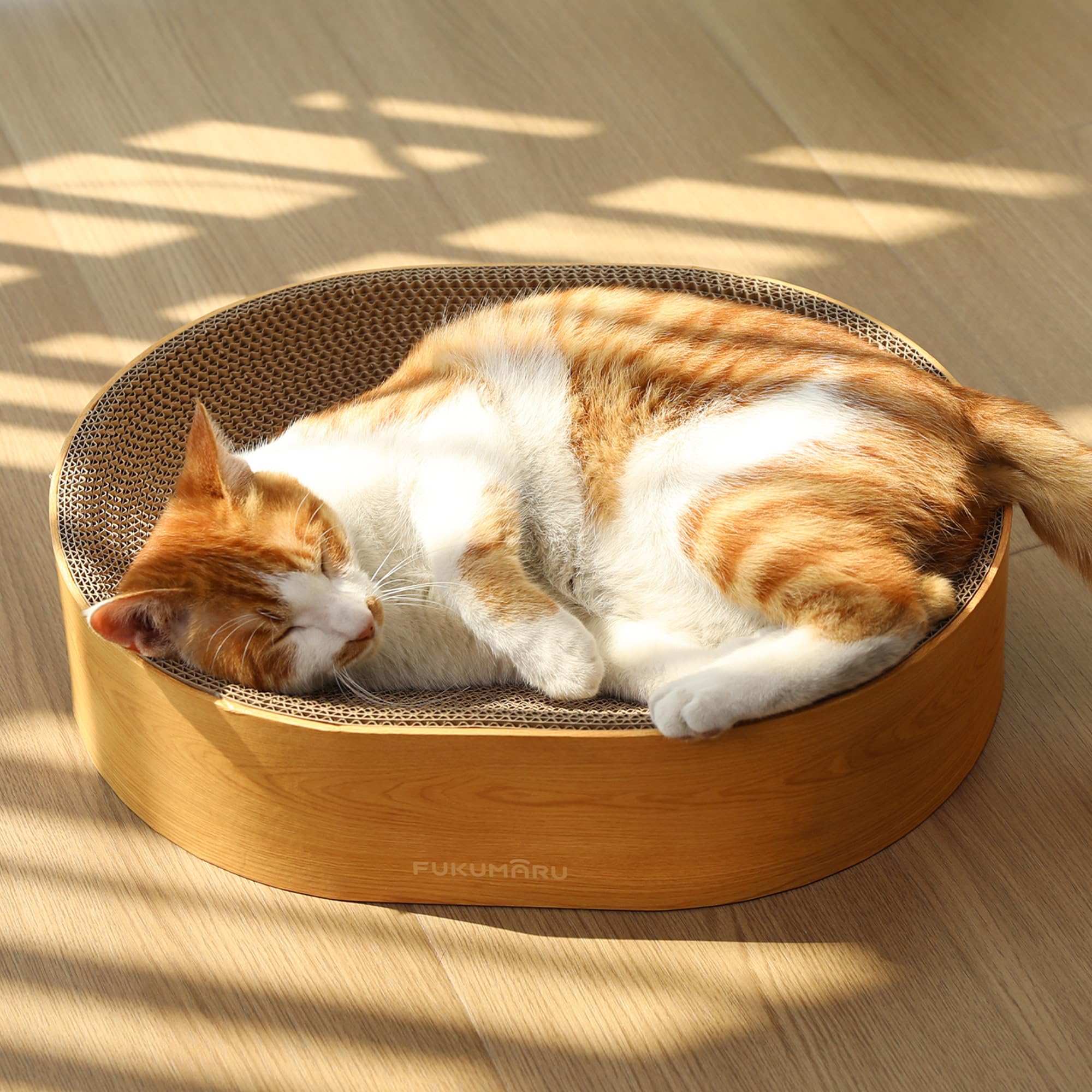FUKUMARU cama-rascador-gato-oval: apoyo ergonómico para rascar y estirarse.