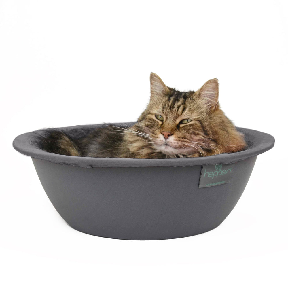 Nido Hepper para gatos, cama redonda lavable, ideal para siestas tranquilas.