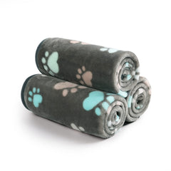 Manta Luciphia gris con dibujo de patas, protege muebles del pelo