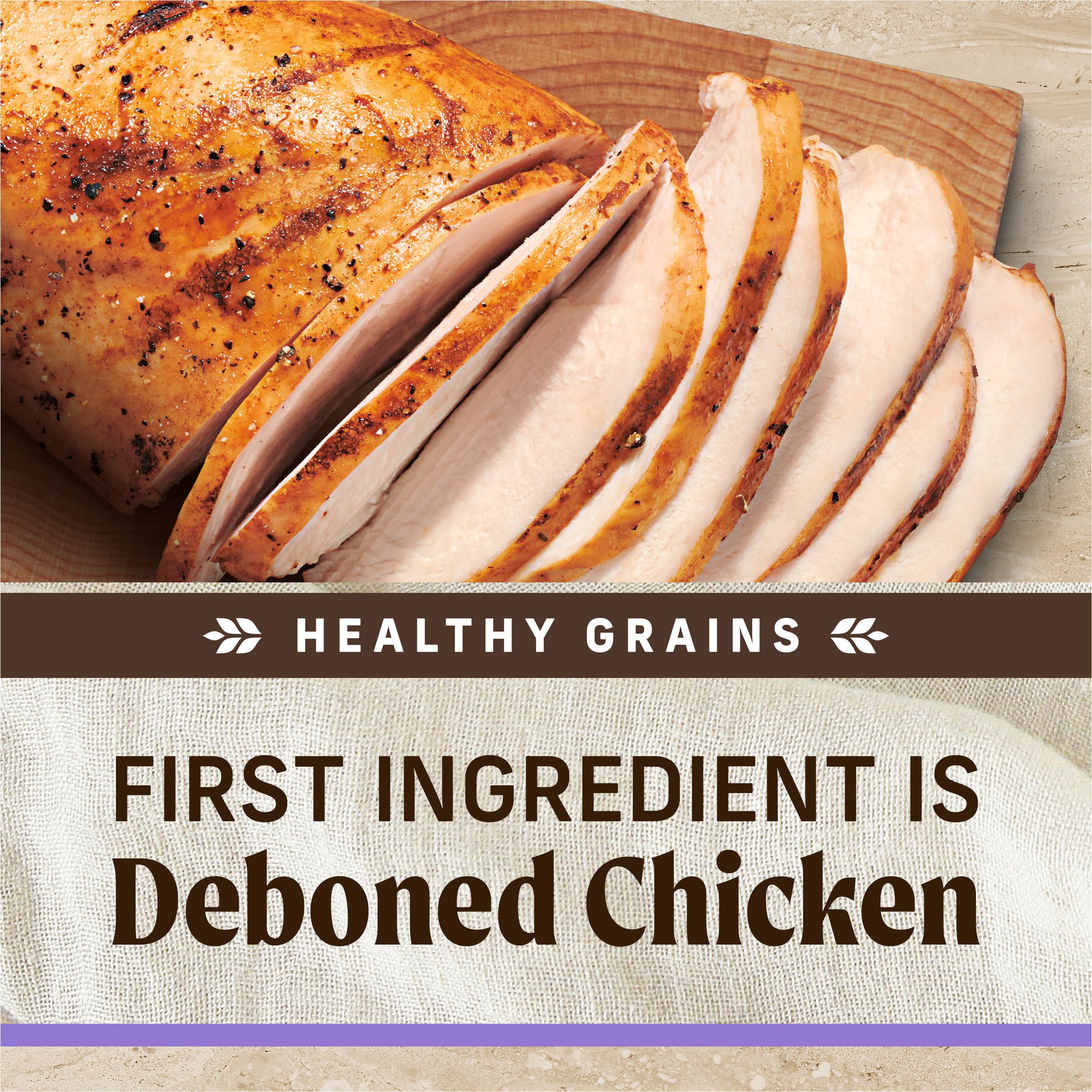 Merrick Healthy Grains para cachorros, pollo deshuesado real visible en la croqueta.