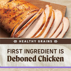 Merrick Healthy Grains para cachorros, pollo deshuesado real visible en la croqueta.