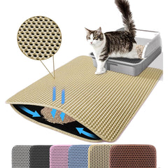 Alfombra Petinstinct extra grande frente a la caja captura migas y mantiene el suelo limpio.