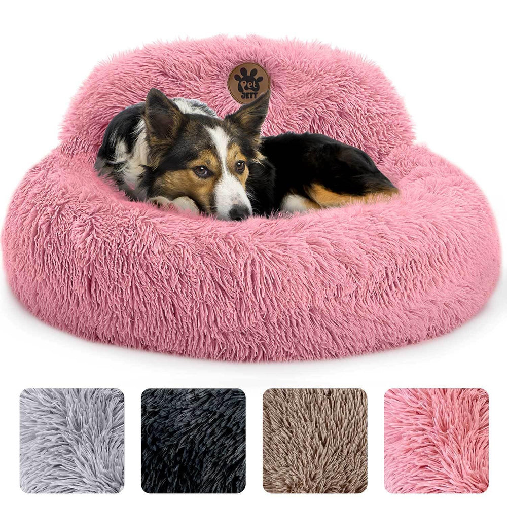 PetJett cama calmante para perro mediano, diseño redondo rosa y confort suave para relajarse.