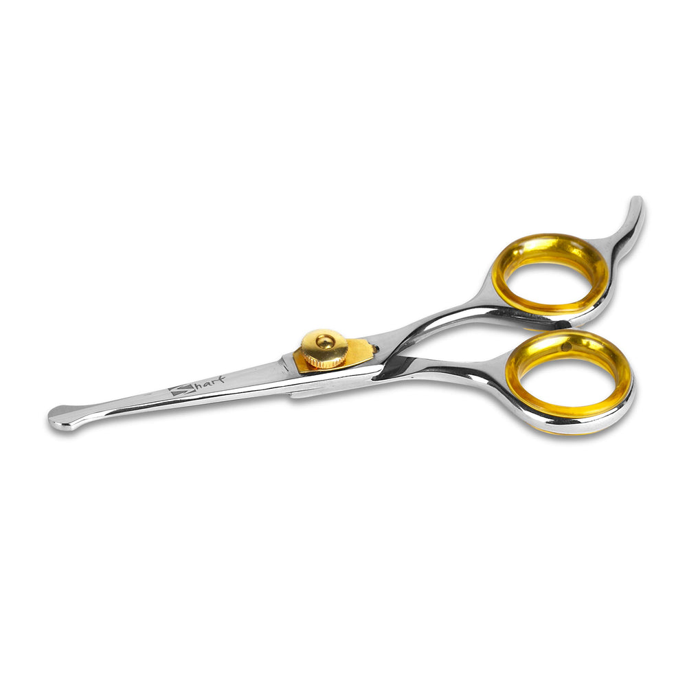 Uso en mascotas: tijeras Sharf Gold Touch para rostro y patas.