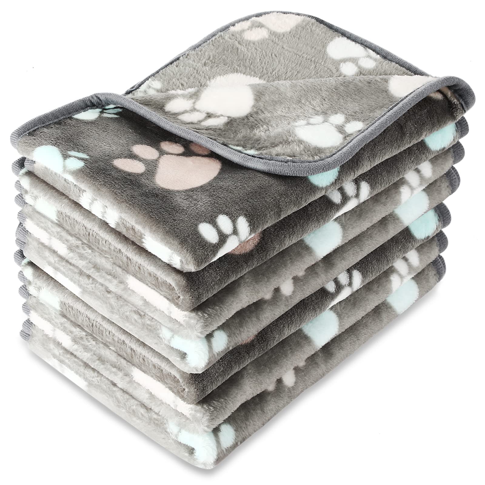 Manta Tatuo con huellas para perros, ideal para siestas confortables en casa.