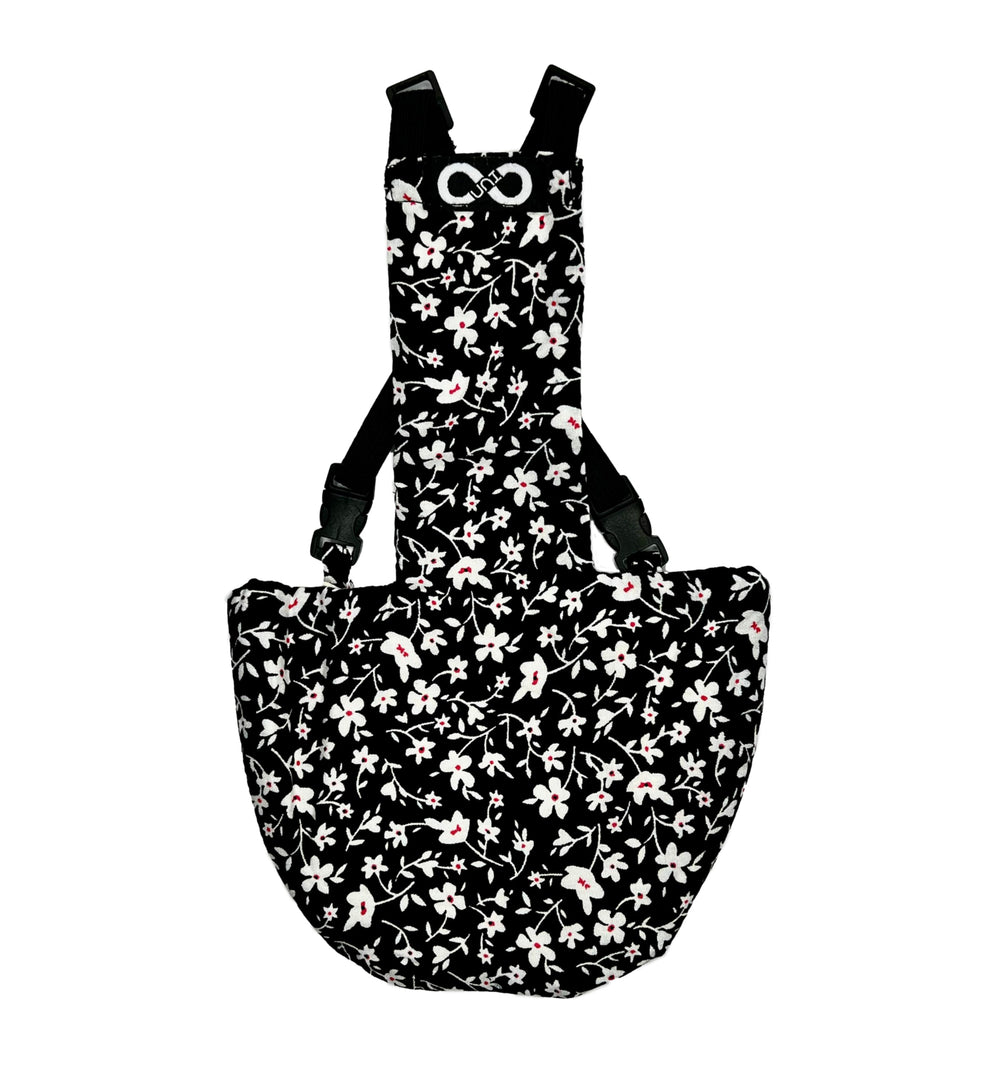 Pañales Uni Infinity para gallinas, negro floral, ajuste cómodo y seguro.