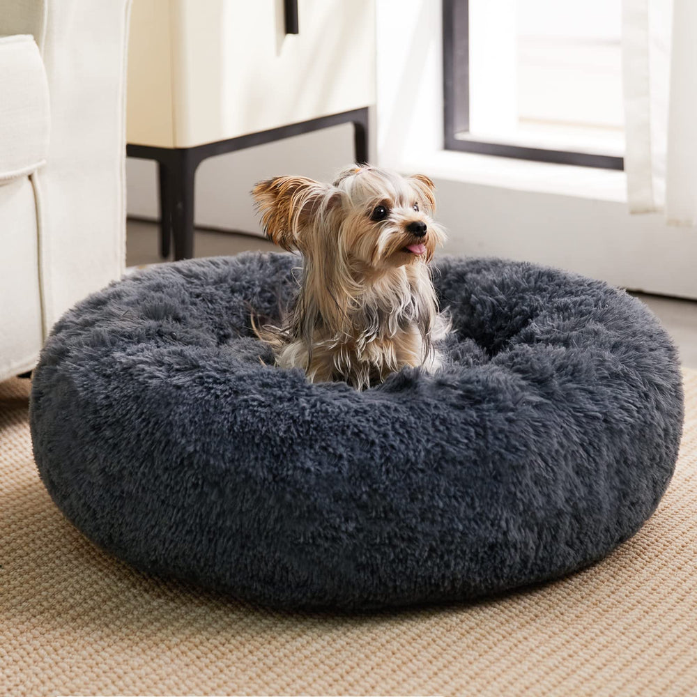 Cama para perros donut de WNPETHOME en azul marino gris para descanso calmante.