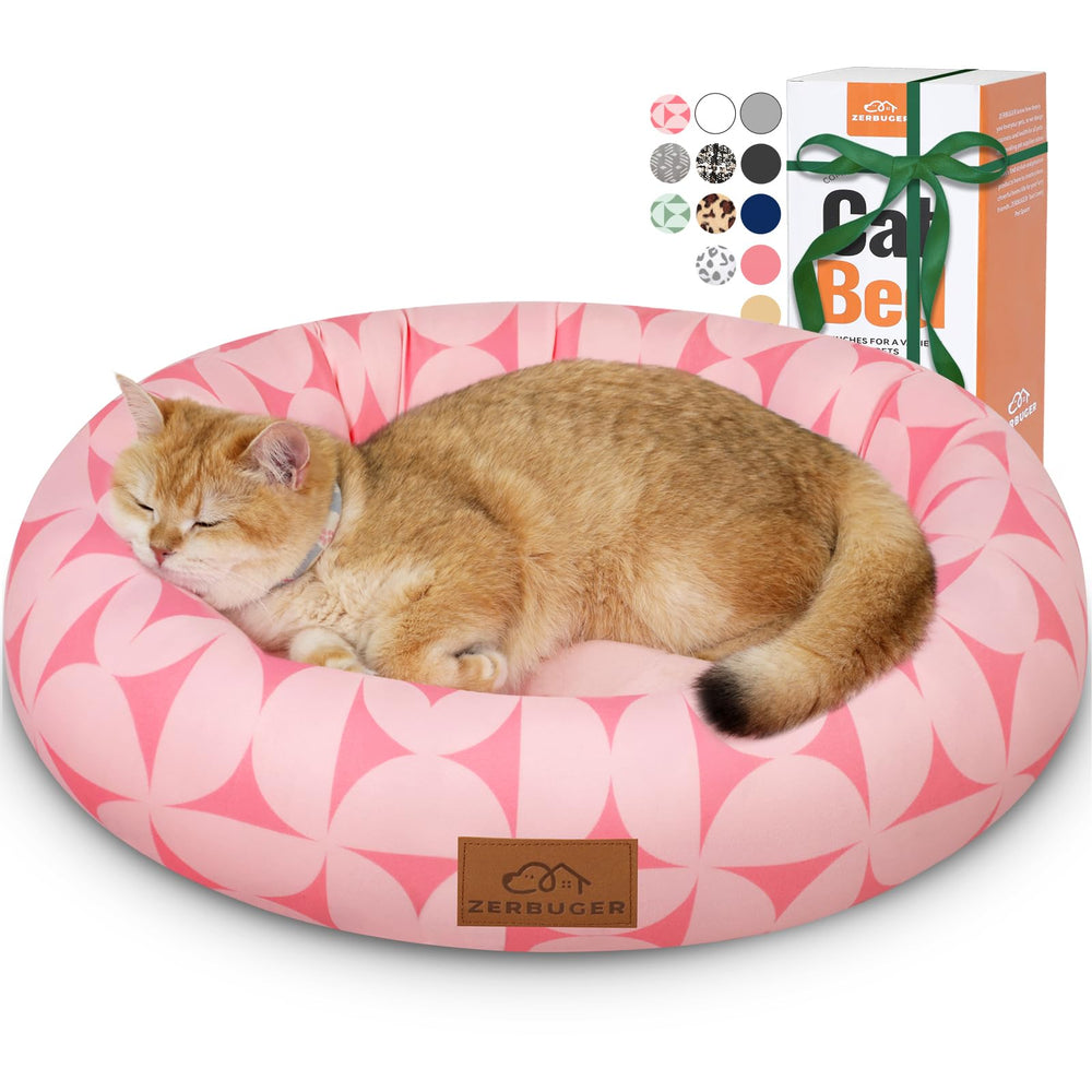 Cama Zerbuger en forma de dona rosada con borde elevado para el cuello durante siestas